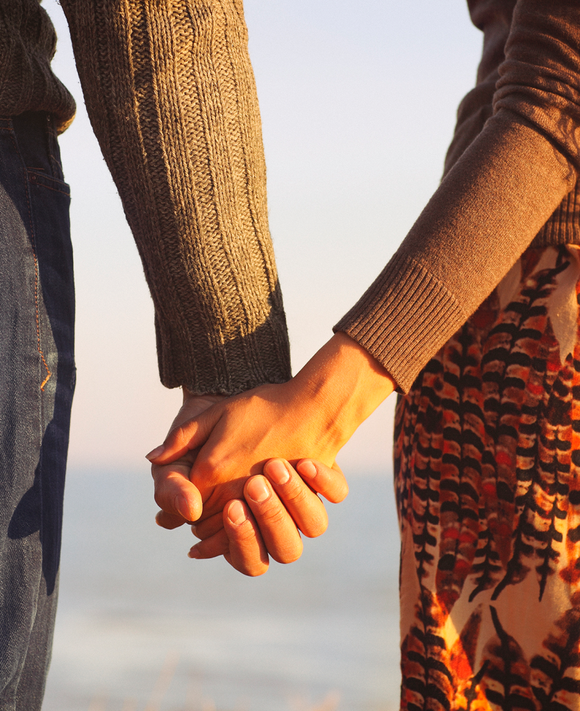two people holding hands