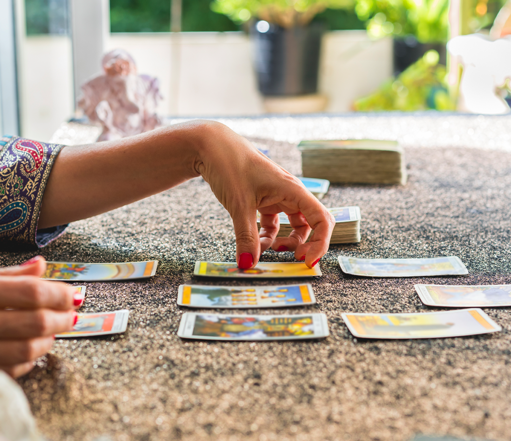 medium sorting through tarot cards